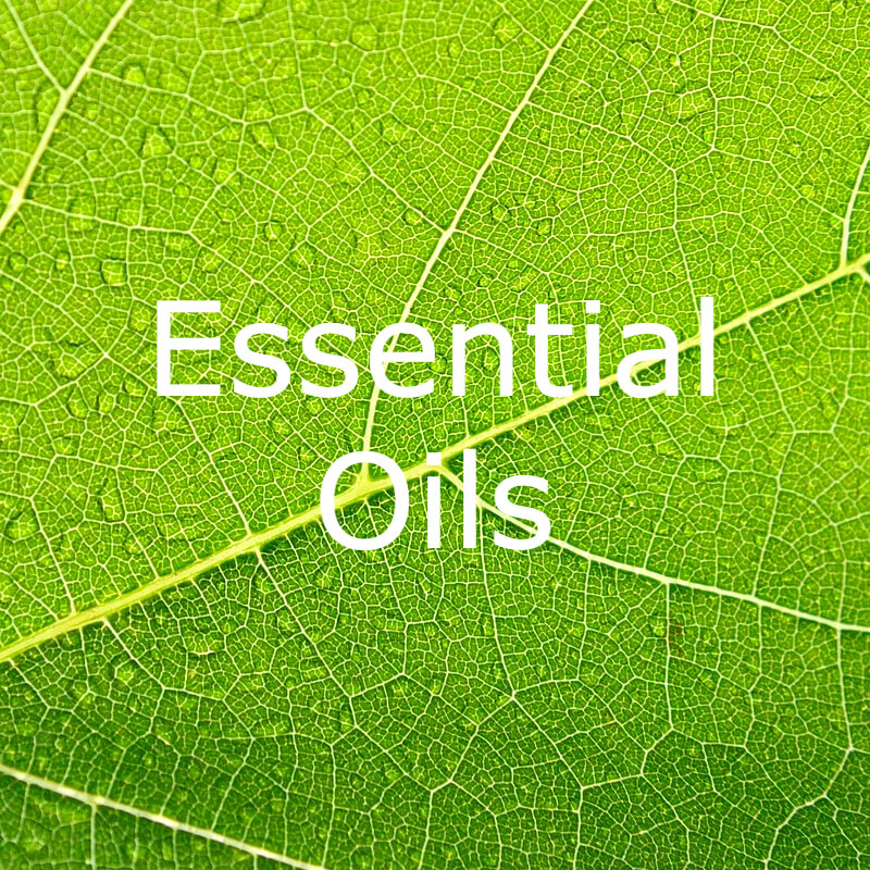 Essential Oils text on green leaf background