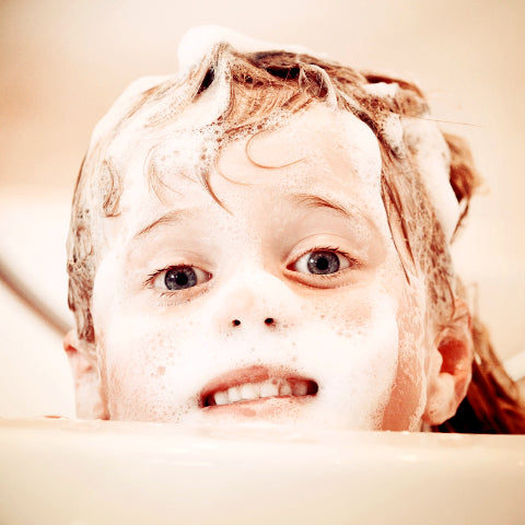 Child with foamy shampoo hair