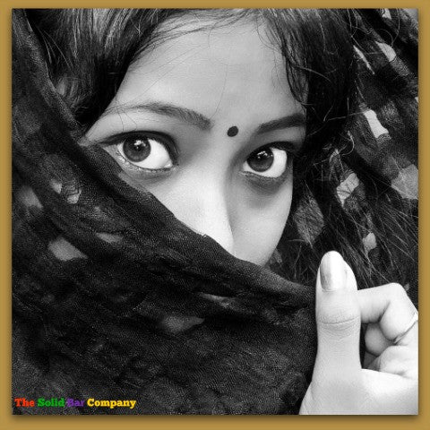 Image of a pretty Indian girl's eyes as she is hiding her face