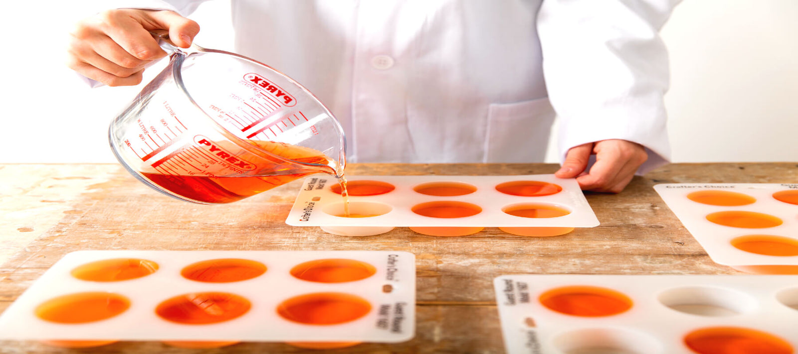 Pouring shampoo bar formula into moulds